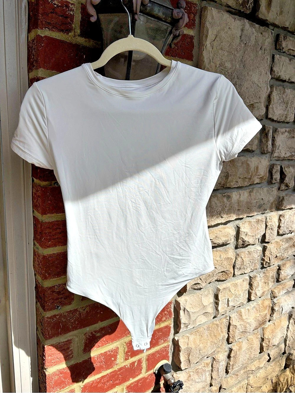 The Short-Sleeve Crew Neck Bodysuit White Short Sleeve Bodysuit